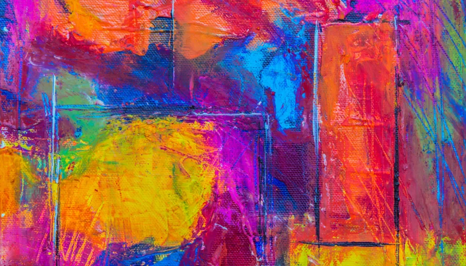 Tela con pennellate di colori intensi: gialli, magenta, blu e arancioni